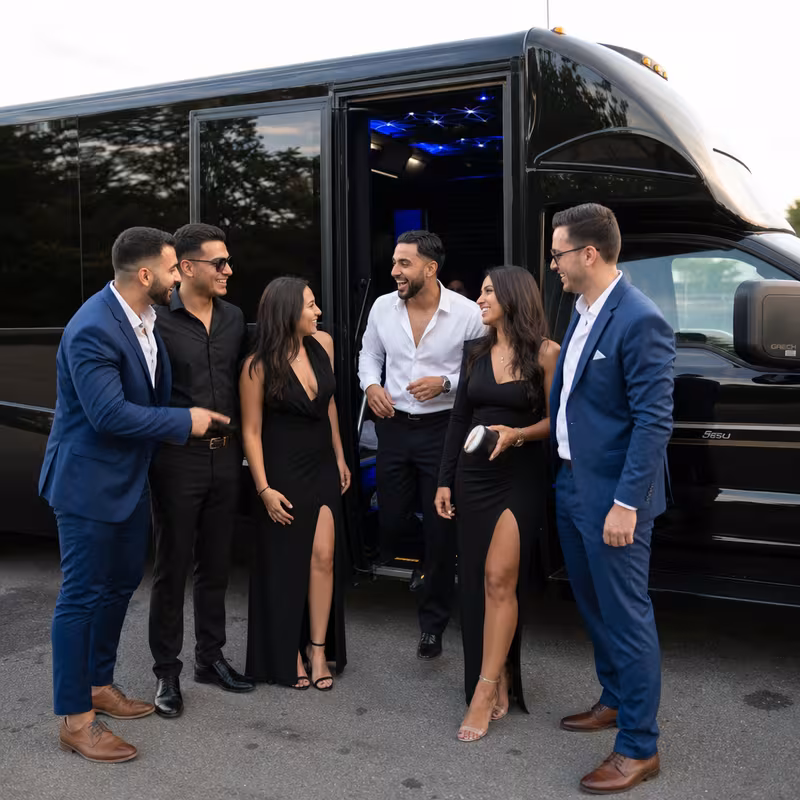 Passengers loading luggage while boarding an Cleveland group shuttle