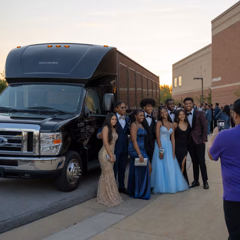 Group boarding a white charter bus for Prom & Homecoming Transportation transportation in Cleveland