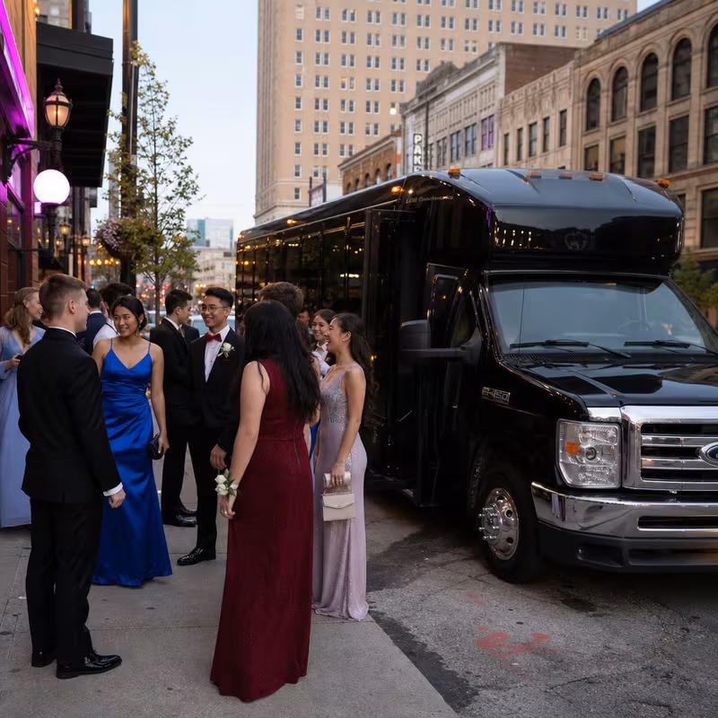 Passengers loading luggage while boarding an Cleveland group shuttle