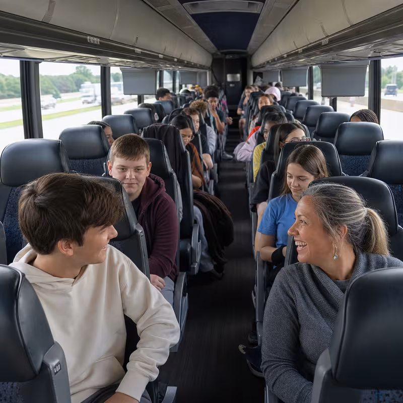 Group boarding a white charter bus for School Transportation transportation in Cleveland