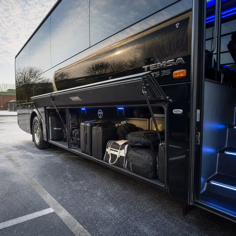 Party bus interior with wraparound leather seating and LED lighting in Cleveland