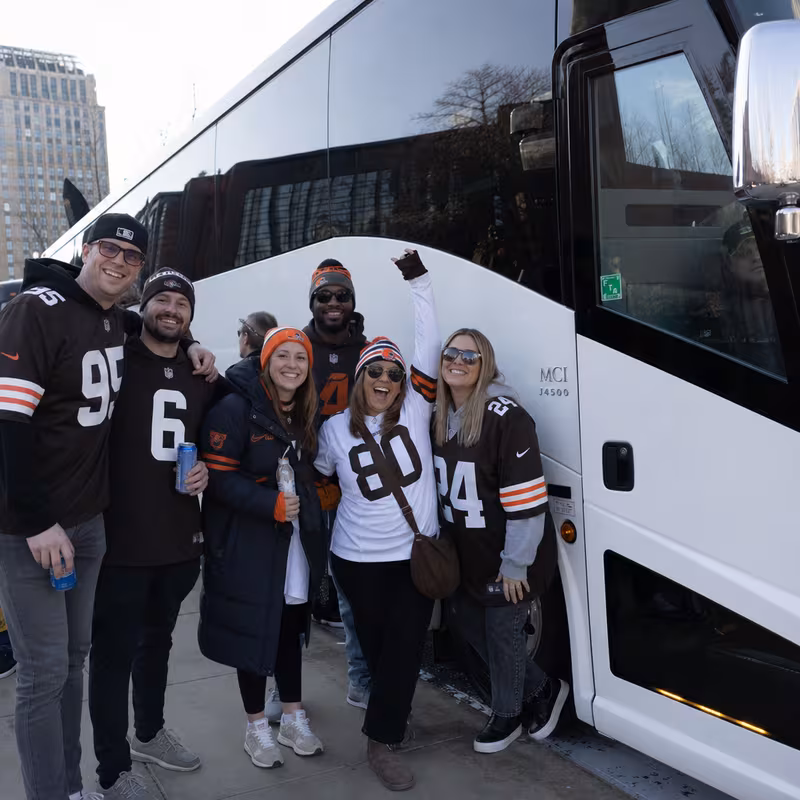 Passengers loading luggage while boarding an Cleveland group shuttle