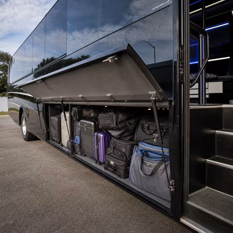 Party bus interior with wraparound leather seating and LED lighting in Cleveland