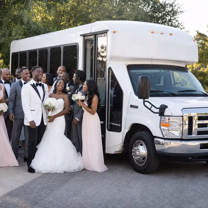 Passengers loading luggage while boarding an Cleveland group shuttle