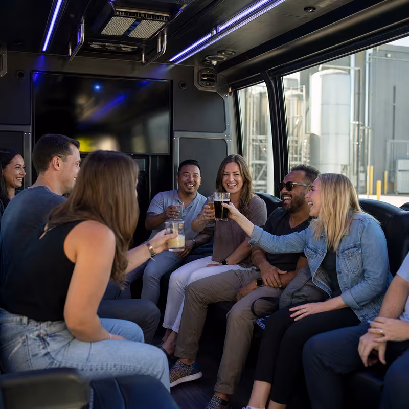 Group boarding a white charter bus for Winery & Brewery Tour Transportation transportation in Cleveland