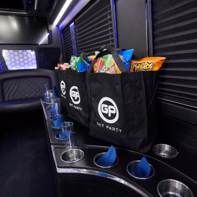 Party bus interior with wraparound leather seating and LED lighting in Cleveland